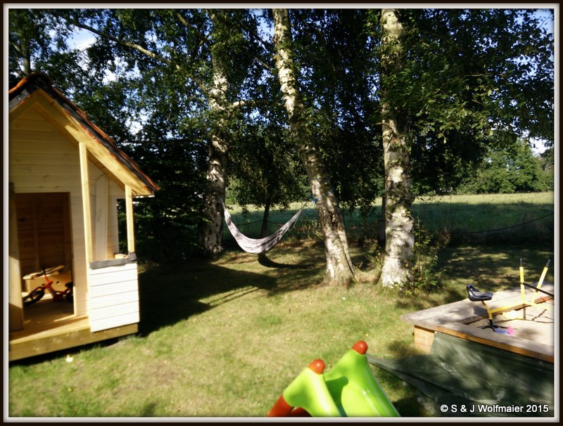 Playhouse, hammock and sandbox