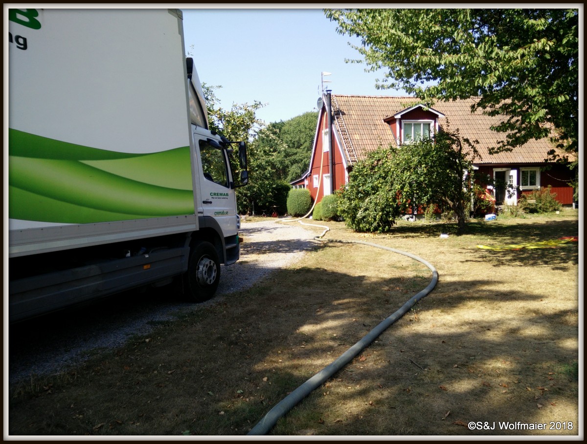 The truck with the insulation pumping into our house.